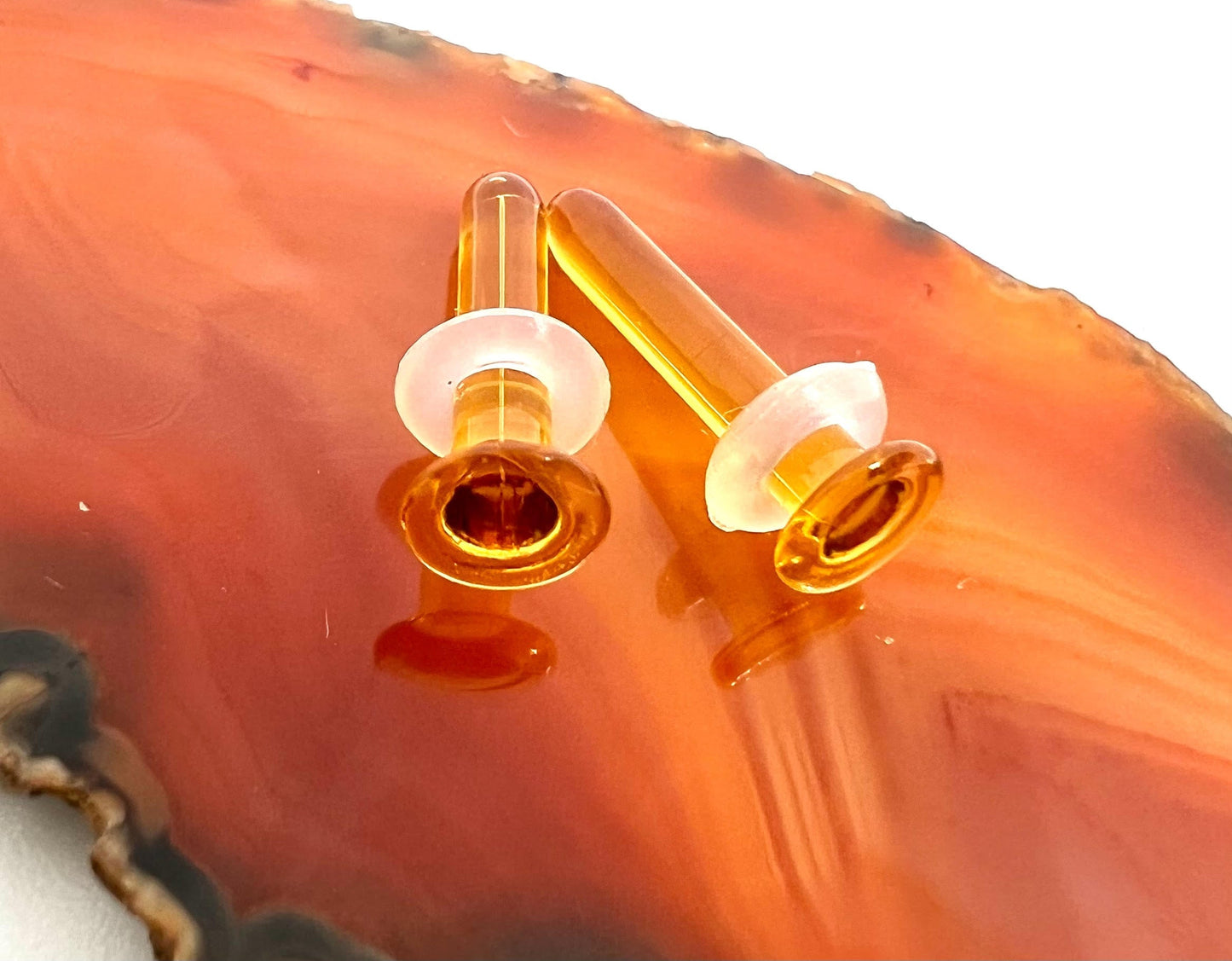 Amber hand blown glass plugs. Fantastic starter pieces for your ear stretching journey!