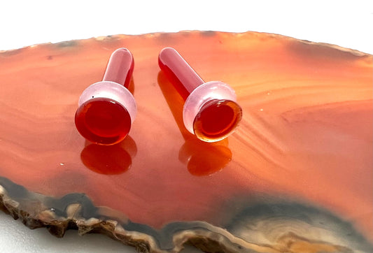 Red hand blown glass plugs. Fantastic starter pieces for your ear stretching journey!